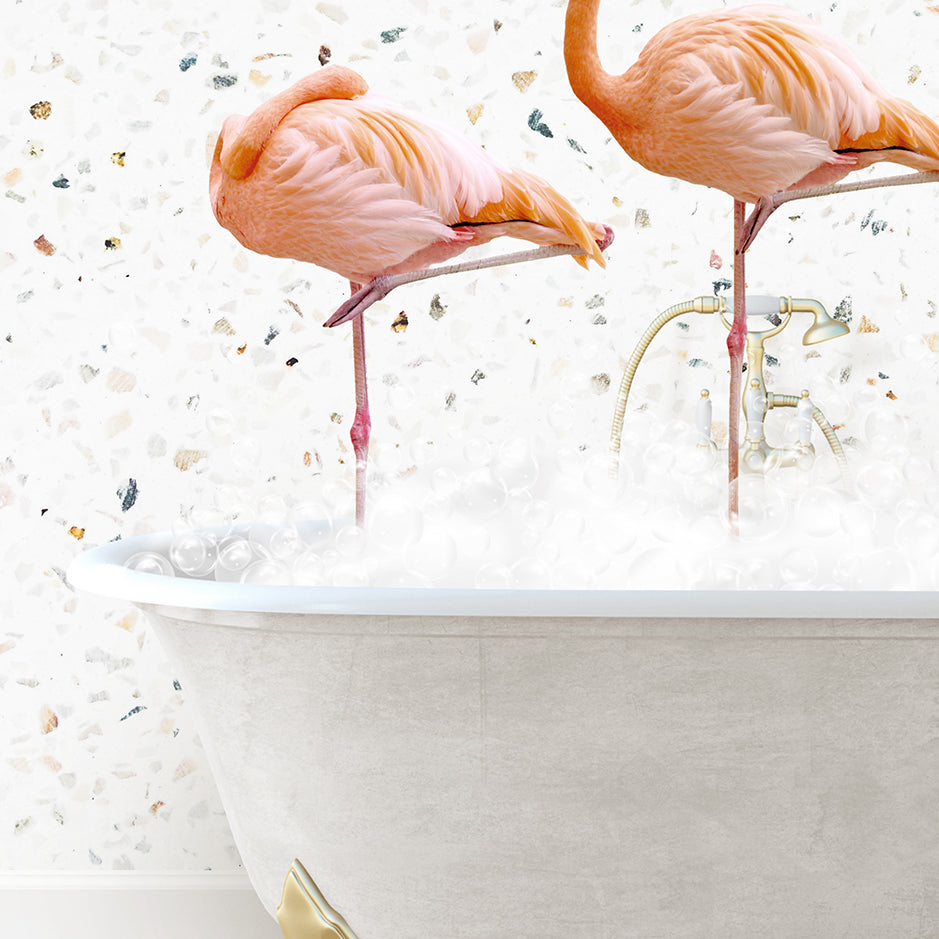 two flamingos standing on legs in a bathtub