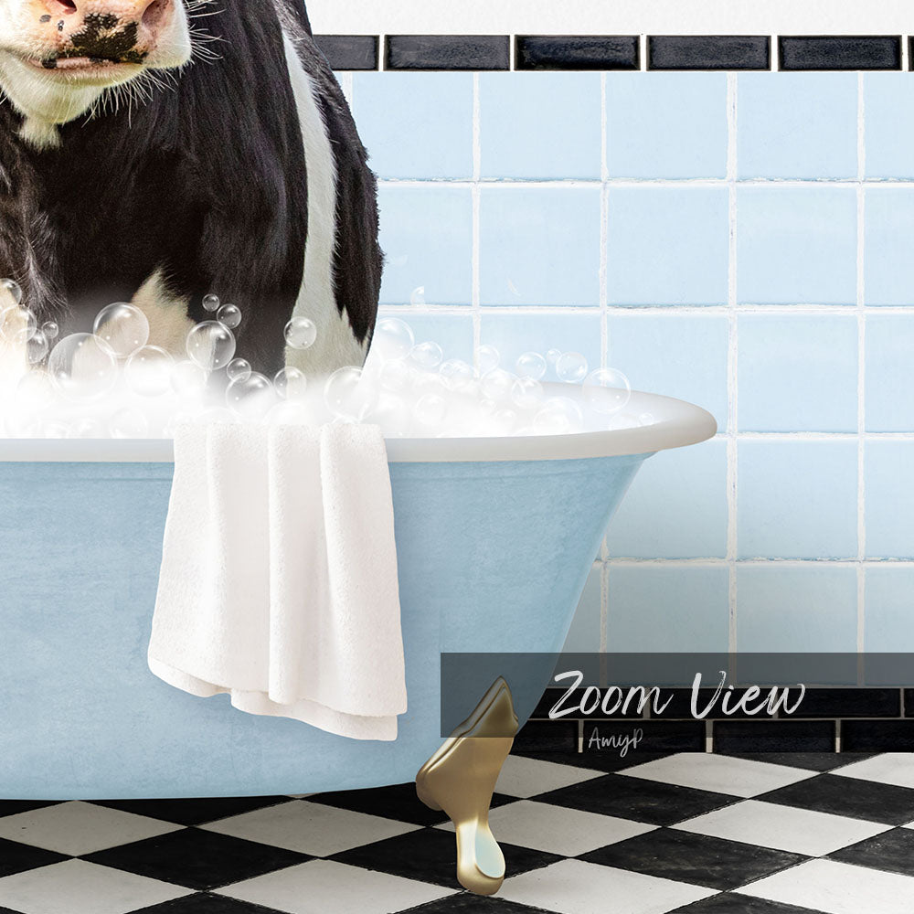 A black and white cow is sitting in a blue bathtub filled with bubbles, with a towel draped over its back and a checkered floor in the background.