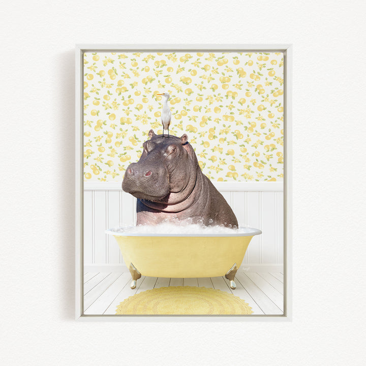 A hippopotamus sitting in a yellow bathtub, with a bird perched on its head.