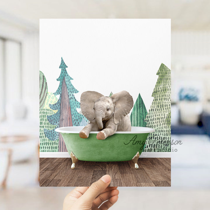 a person holding up a card with an elephant in a bathtub