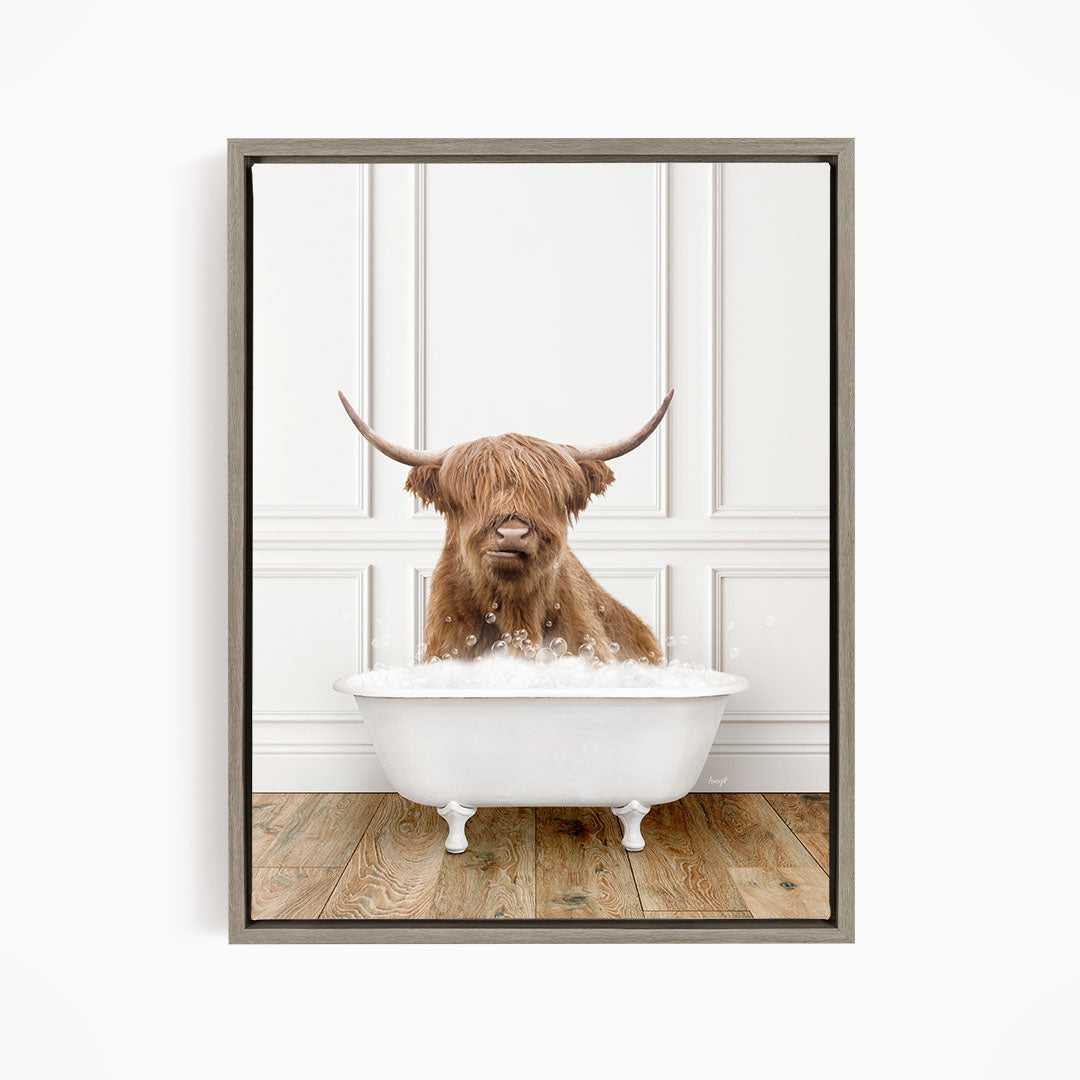 A brown cow with long horns is sitting in a white bathtub filled with water, creating a whimsical and playful scene.