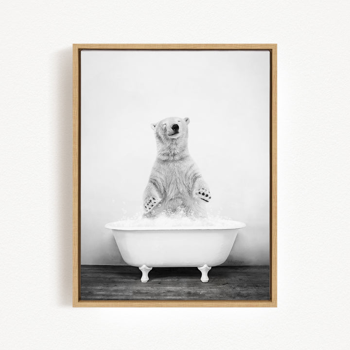 A polar bear standing in a white bathtub filled with water, appearing to be enjoying a bath.