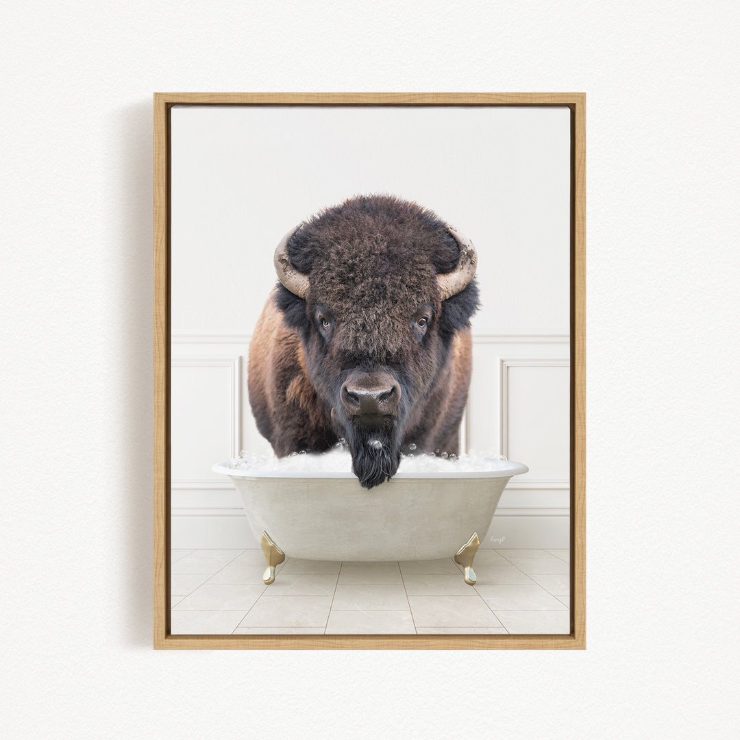 A buffalo with a long beard is sitting in a white bathtub, looking directly at the camera.