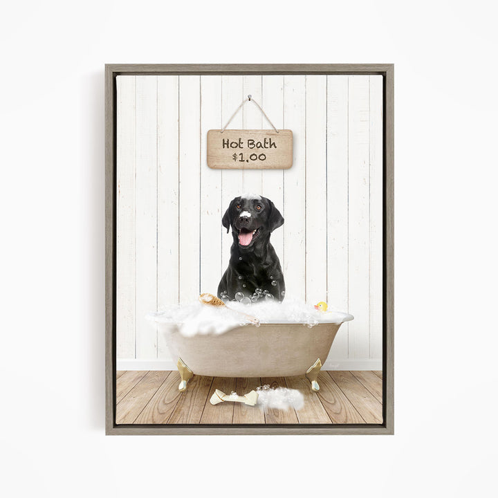 A black dog sitting in a white bathtub filled with bubbles, with a sign above the tub indicating a hot bath for $1.00.