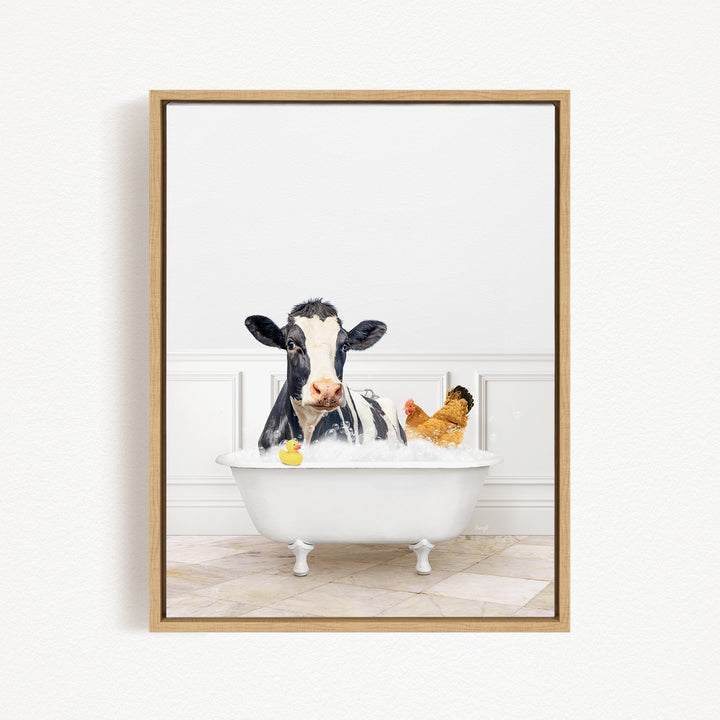 A black and white cow is sitting in a white bathtub, surrounded by a yellow rubber duck and a chicken, creating a whimsical and playful scene.