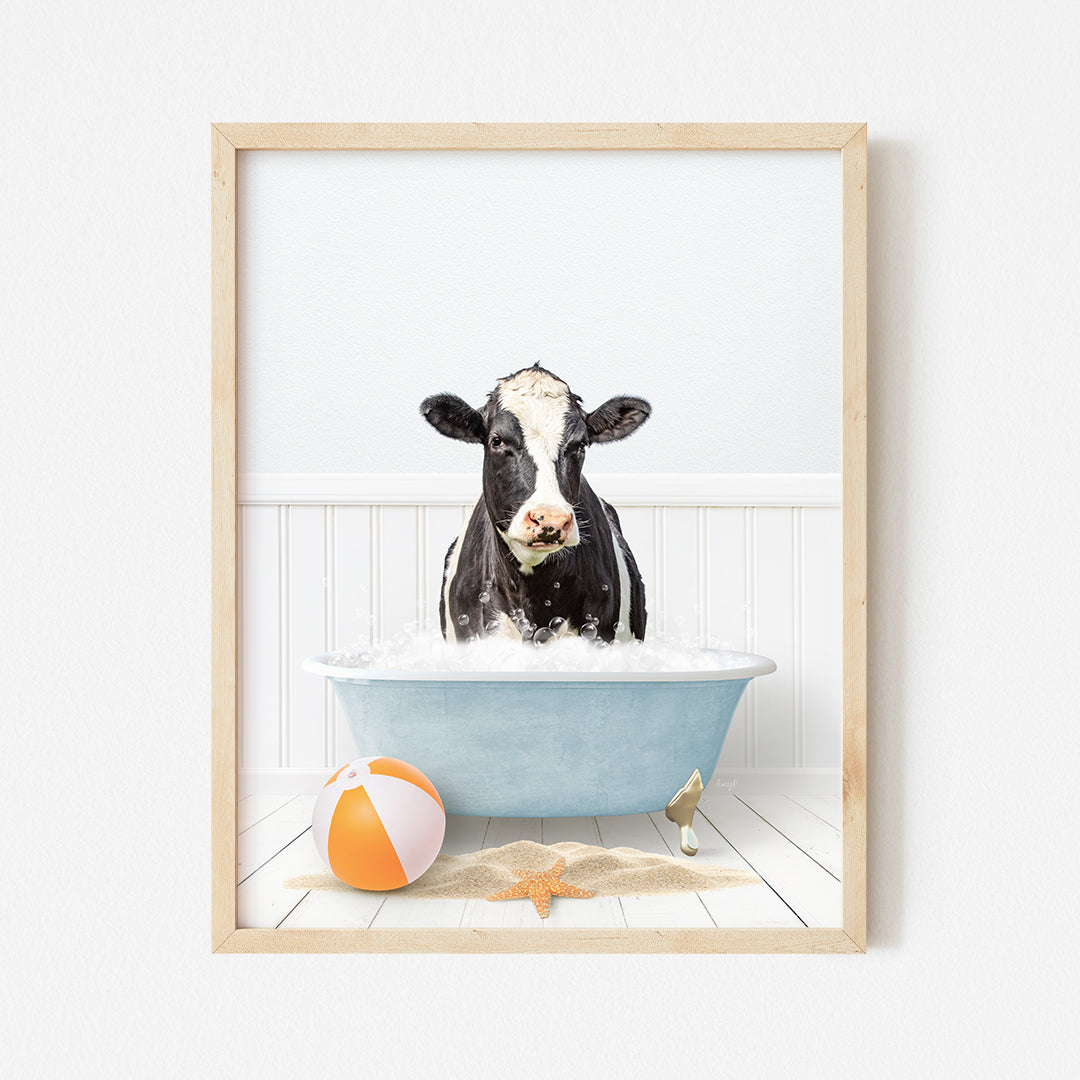 a picture of a cow in a bathtub with a beach ball