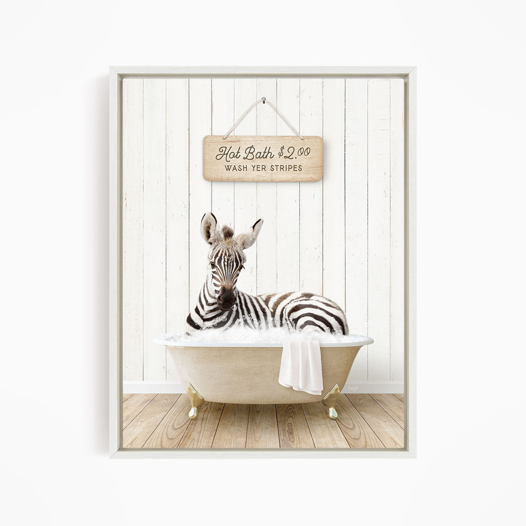 A zebra is sitting in a bathtub, with a sign above it that reads "Hot Bath $2.00 WASH YER STRINGS".