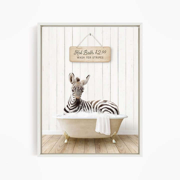 A zebra is sitting in a bathtub, with a sign above it that reads "Hot Bath $2.00 WASH YER STRINGS".