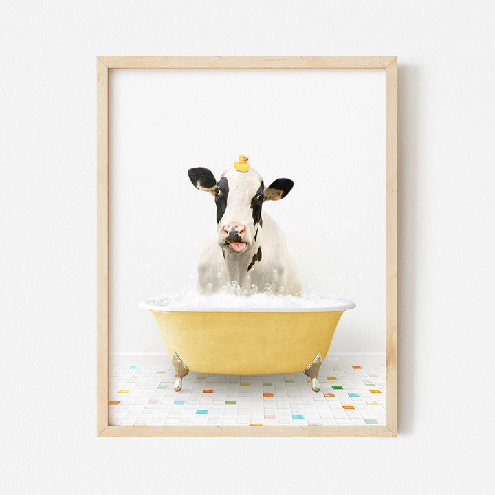 a cow in a bathtub with a rubber duck in it's mouth