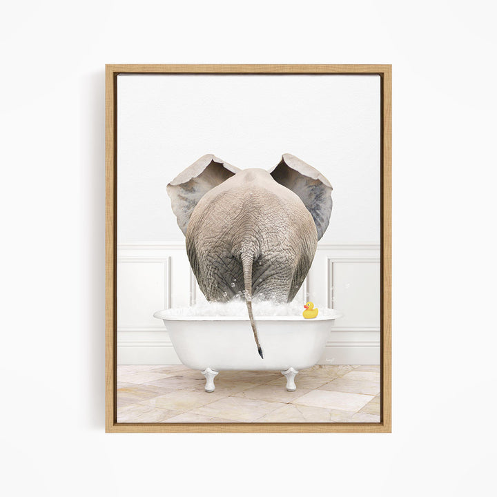 An elephant is standing in a white bathtub filled with water, with a rubber duck floating nearby.