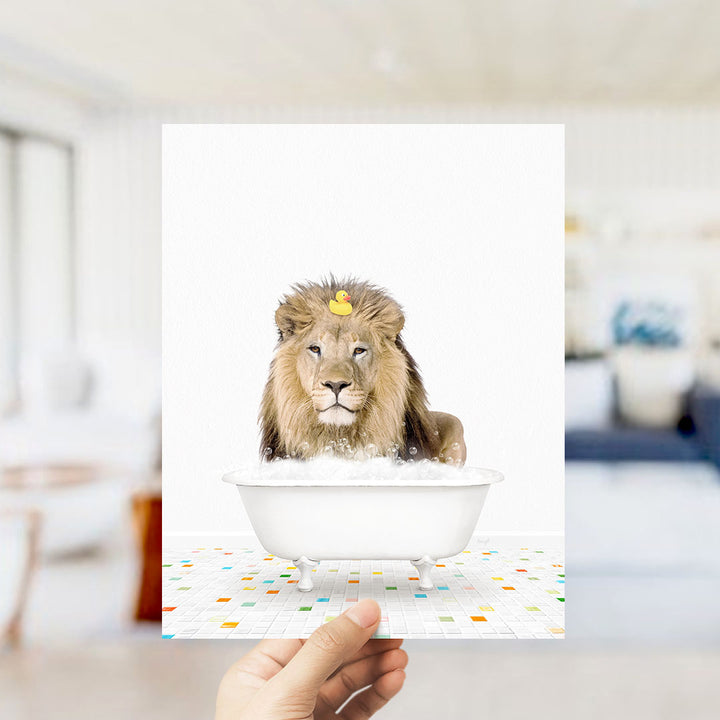 A lion is sitting in a bathtub filled with bubbles, with a yellow rubber duck floating on its head.