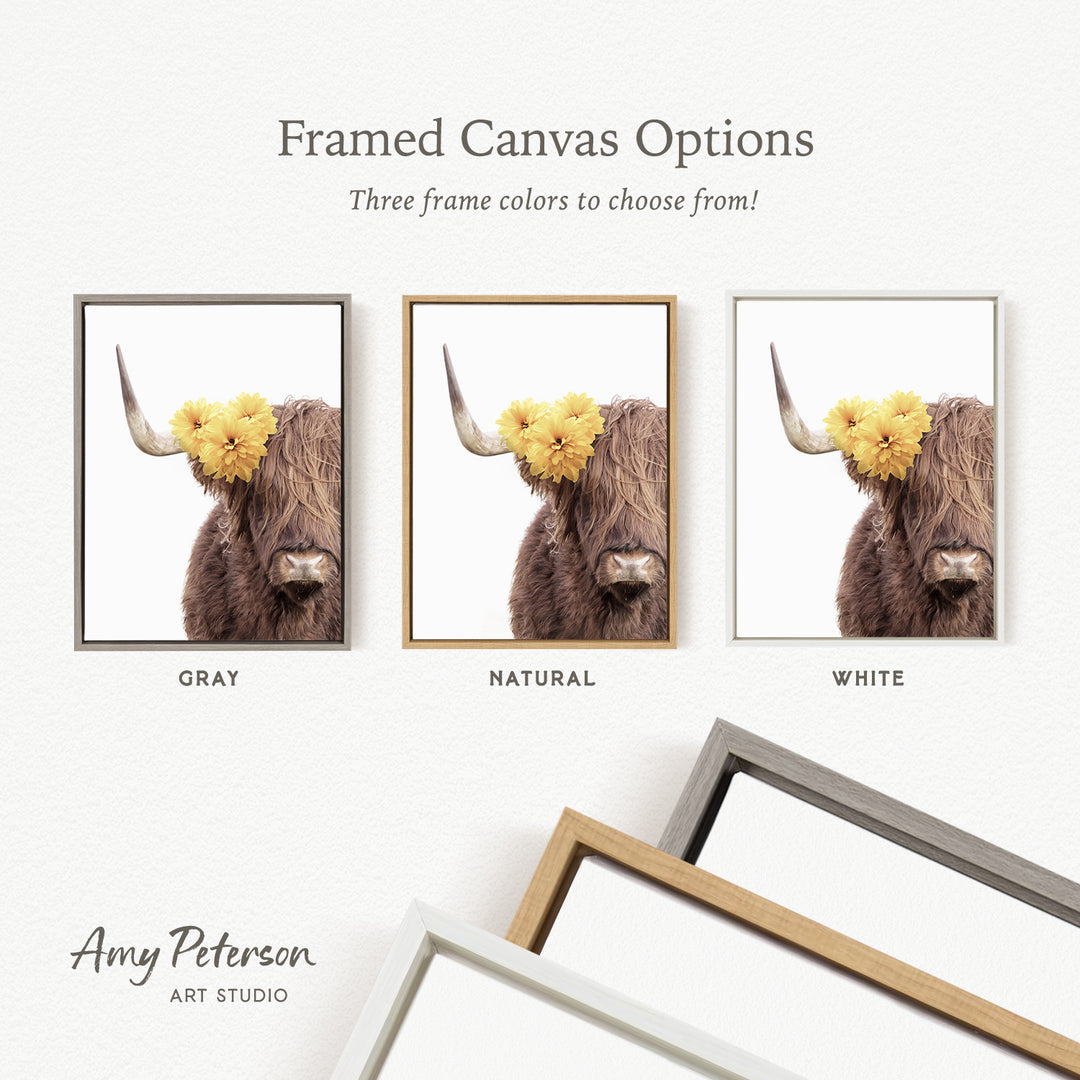 three framed canvas options for a picture of a cow with flowers on its horns. The options include a gray frame, a natural frame, and a white frame.