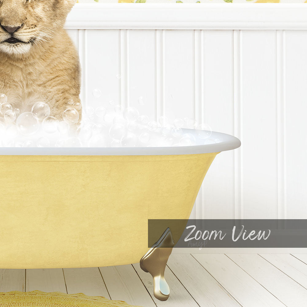 A cat sitting in a yellow bathtub filled with bubbles, with a white wall and wooden floor in the background.