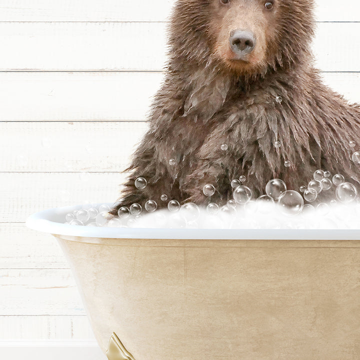 a brown bear sitting in a bathtub filled with bubbles