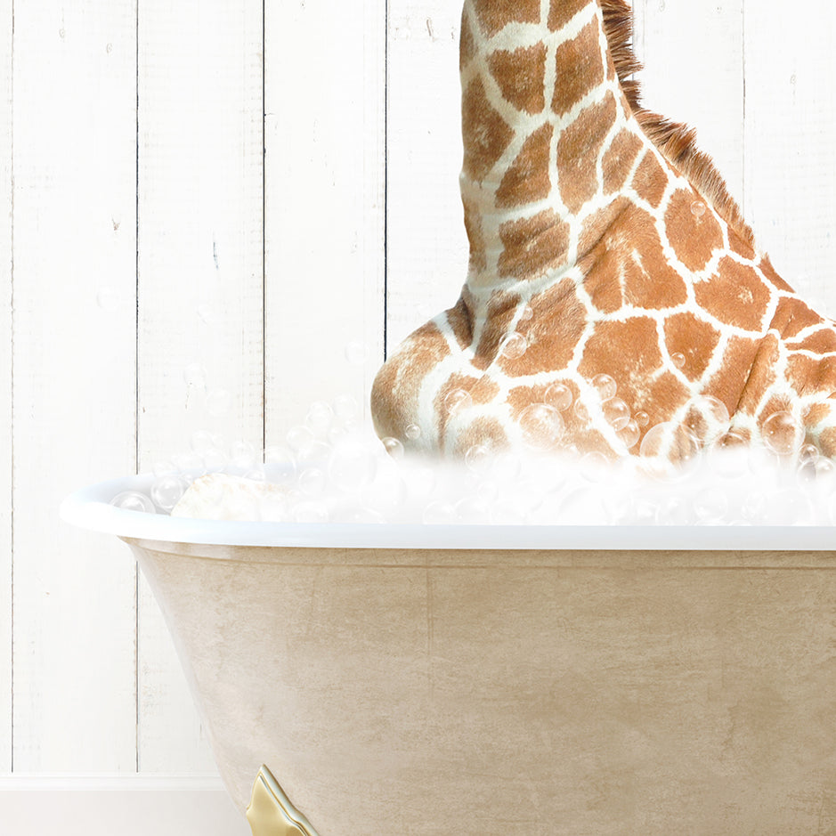 a giraffe sitting in a bathtub with foam on it