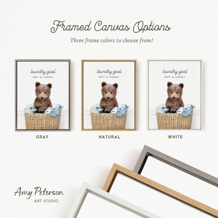 three framed canvas options, each featuring a teddy bear in a basket. The options include a gray frame, a natural frame, and a white frame. The text above the options reads "framed Canvas Options" and "Three frame colors to choose from!".