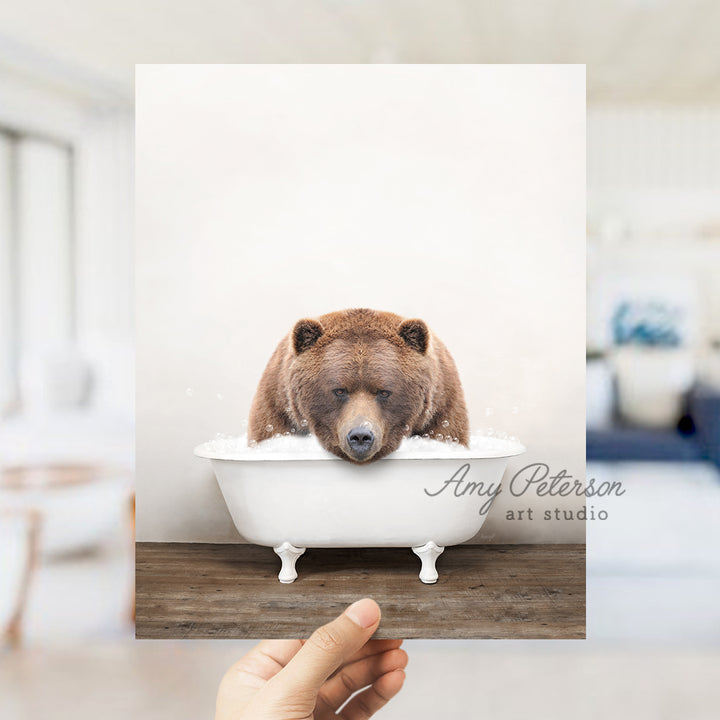 a brown bear sitting in a bath tub