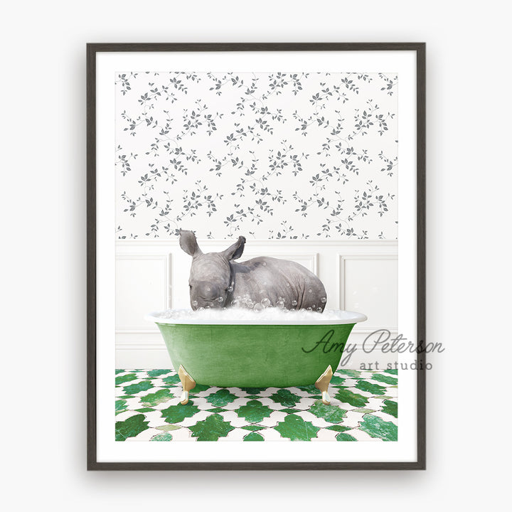 a rhino in a green bathtub with a white wall behind it