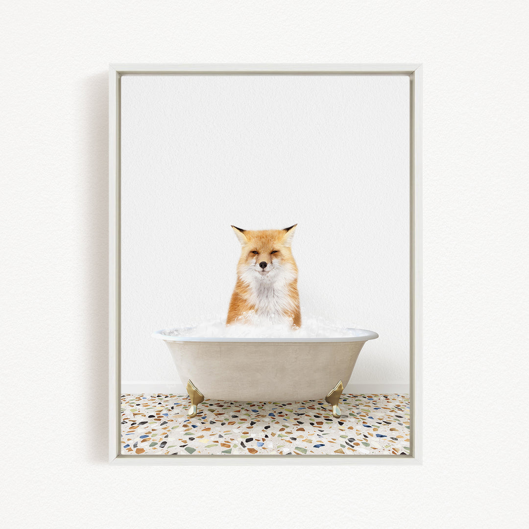 A red fox sitting in a white bathtub filled with water, looking directly at the camera.