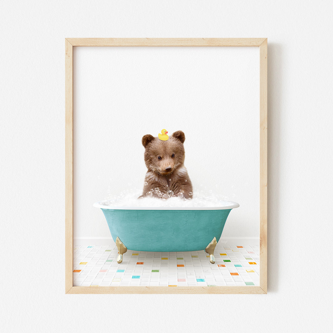 a small teddy bear sitting in a bath tub