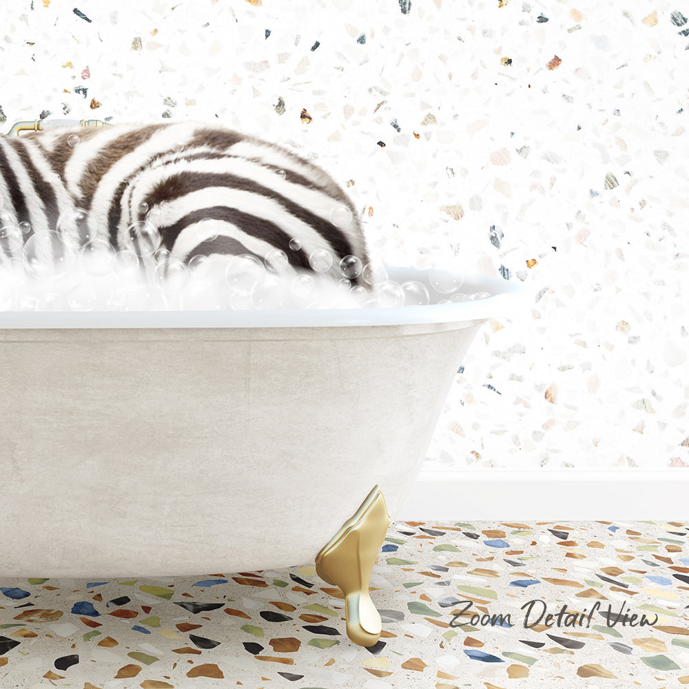 A zebra lying in a bathtub filled with bubbles, surrounded by a colorful mosaic floor.