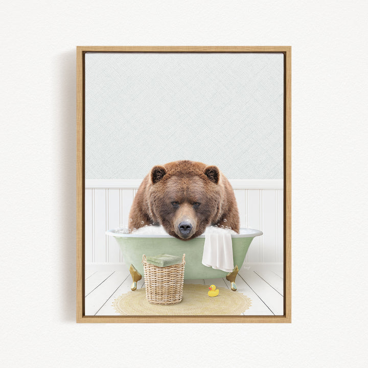 A brown bear is sitting in a green bathtub filled with water, surrounded by a basket of toys and a yellow rubber duck.