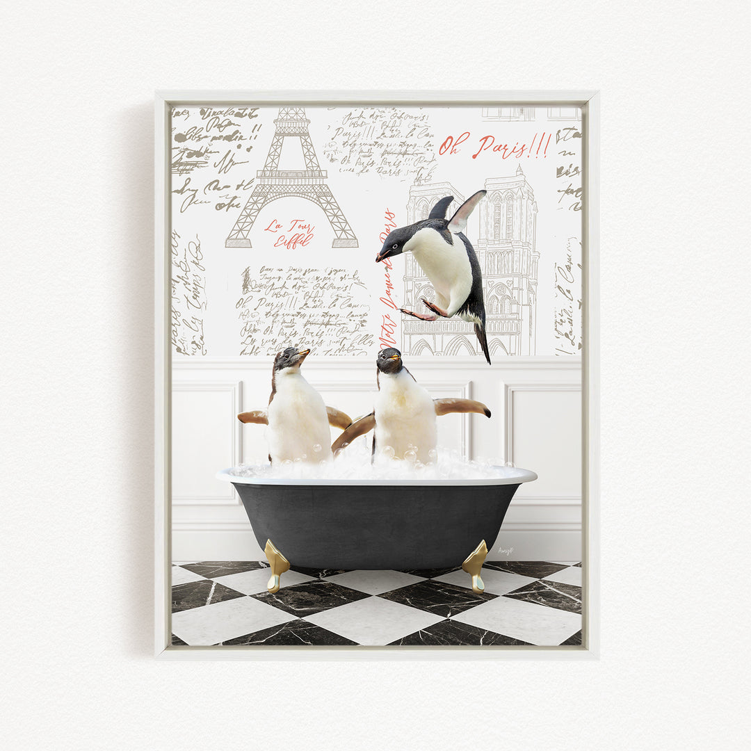 A framed image depicting three penguins sitting in a bathtub, with one penguin flying above the tub and another penguin sitting in the tub. The background features a wall with text and drawings, including the Eiffel Tower.