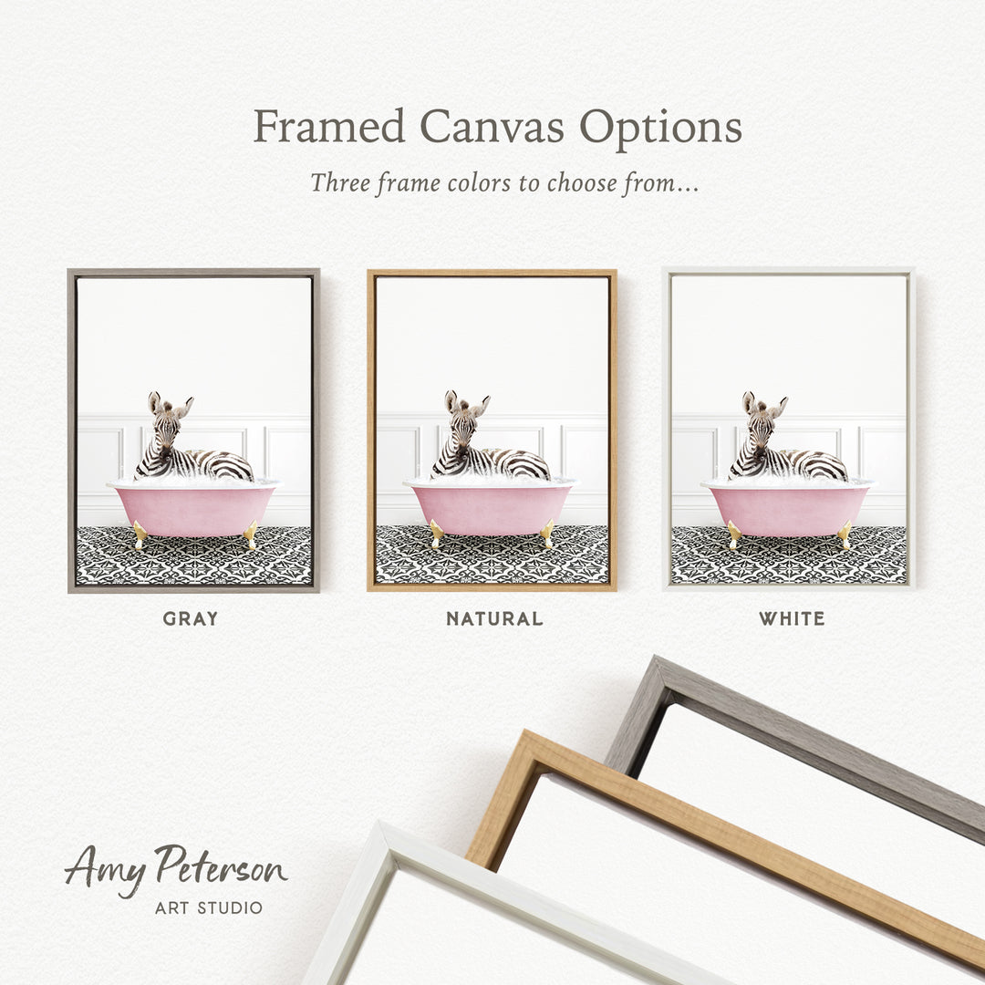 three framed canvas options, each featuring a zebra sitting in a pink bathtub. The options include a gray frame, a natural frame, and a white frame.