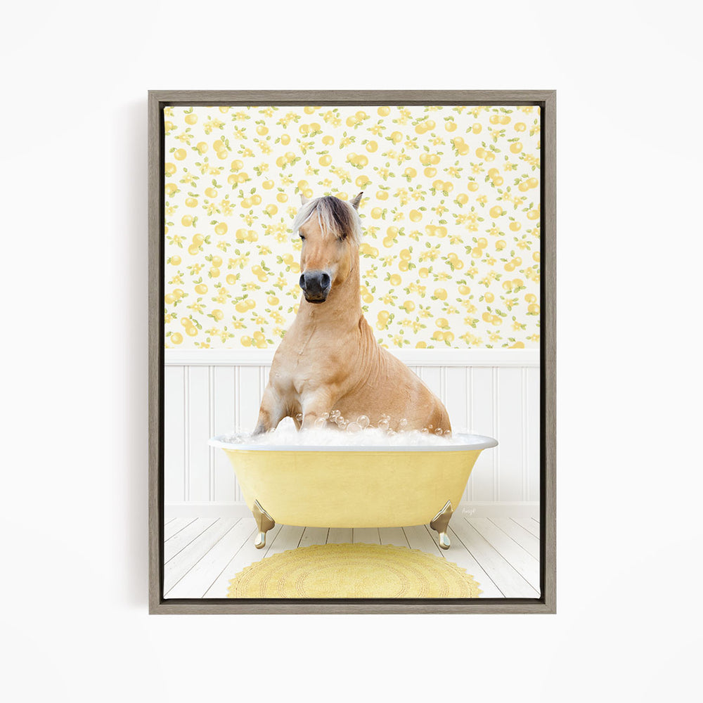 A light brown horse is sitting in a yellow bathtub filled with water, surrounded by a yellow floral wallpaper.