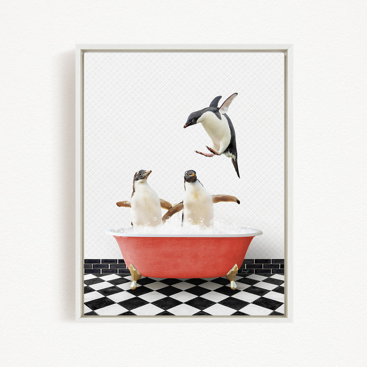 A framed image depicting two penguins standing in a red bathtub filled with water, with one penguin flying towards the other in mid-air.