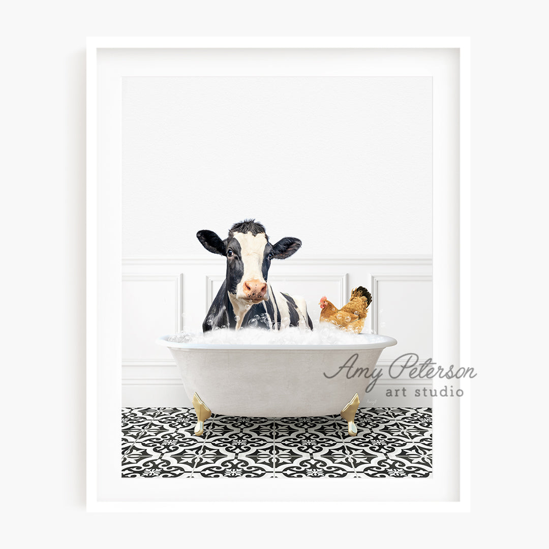 a black and white cow sitting in a bathtub