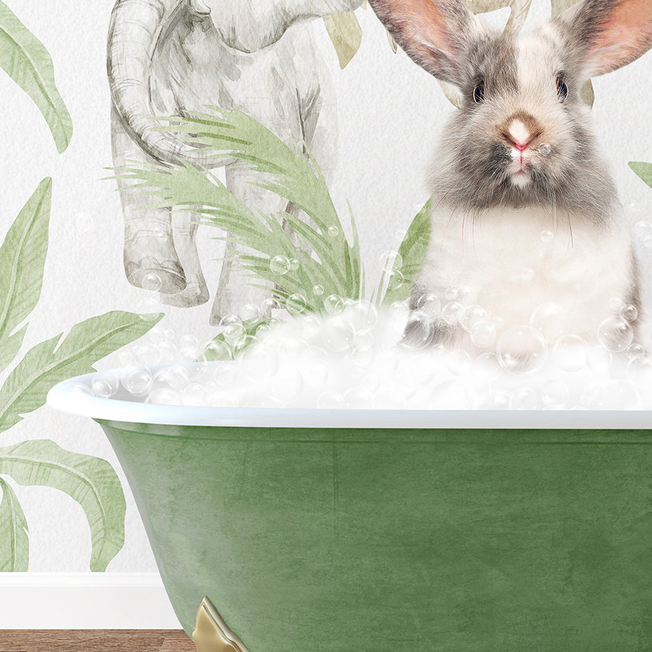 a rabbit sitting in a bathtub filled with foam