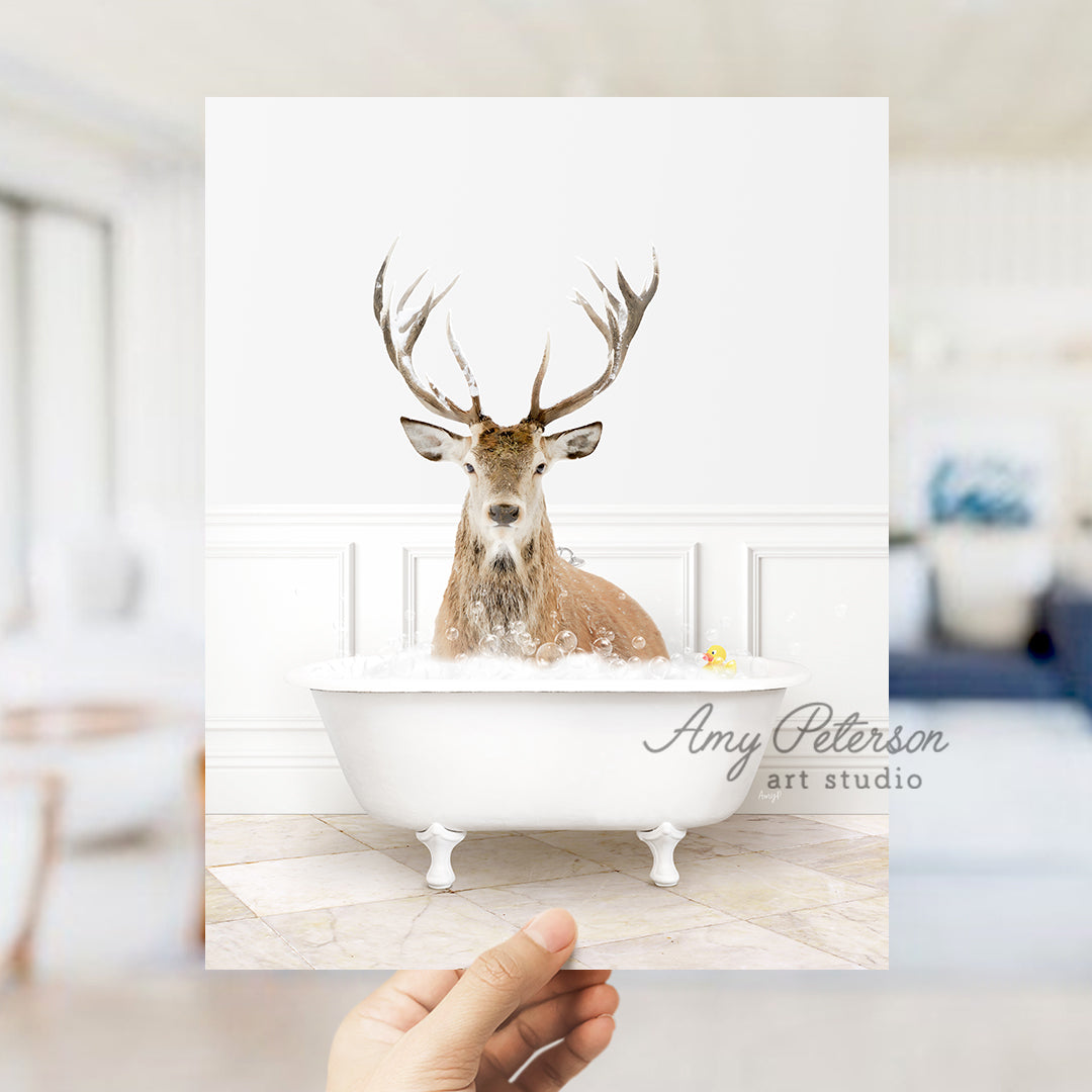 a person holding up a card with a picture of a deer in a bathtub