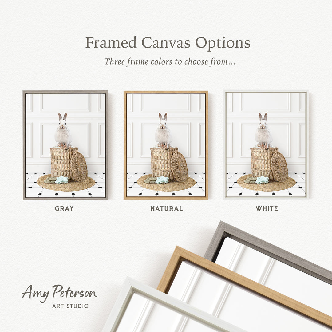 three framed canvas options, each featuring a white rabbit sitting on a basket. The options include a gray, a natural, and a white frame.