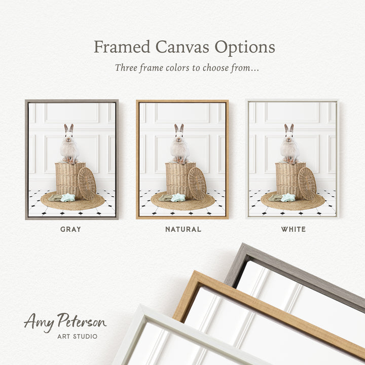 three framed canvas options, each featuring a white rabbit sitting on a basket. The options include a gray, a natural, and a white frame.