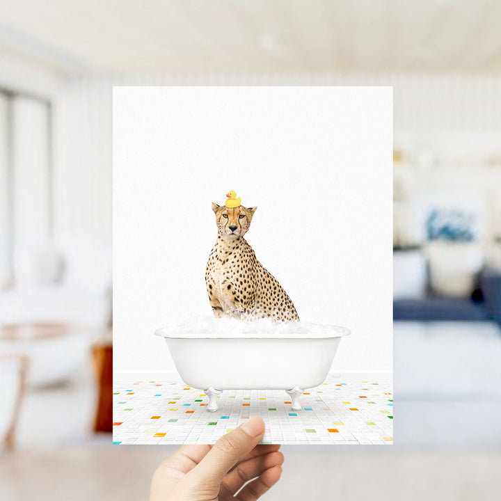 A cheetah sitting in a bathtub filled with bubbles, wearing a yellow rubber duck hat.
