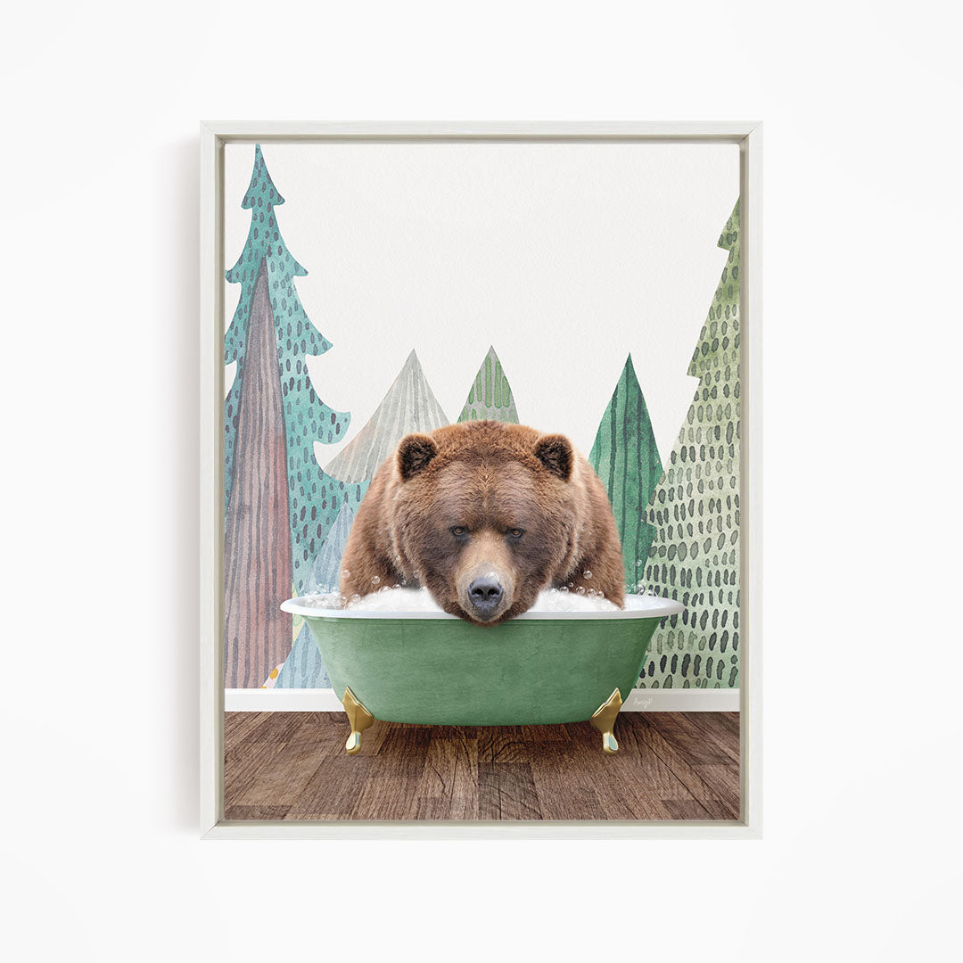 A brown bear is sitting in a green bathtub, surrounded by trees with green and brown foliage.