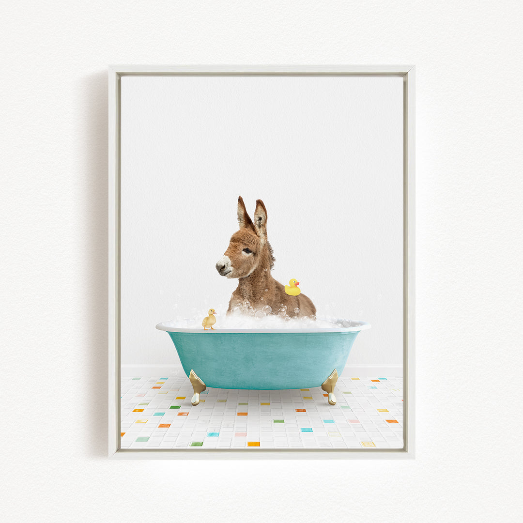 A donkey is sitting in a blue bathtub filled with water, surrounded by several rubber ducks.