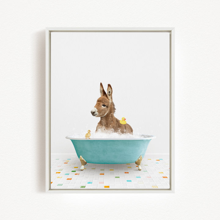 A donkey is sitting in a blue bathtub filled with water, surrounded by several rubber ducks.