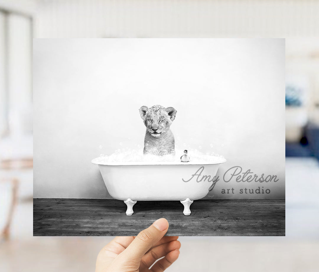 a person holding up a card with a picture of a tiger in a bathtub