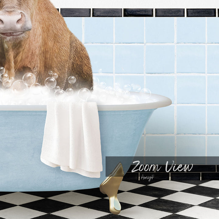 A cow is sitting in a blue bathtub filled with bubbles, with a towel draped over its back and a gold shoe placed on the floor next to the tub.