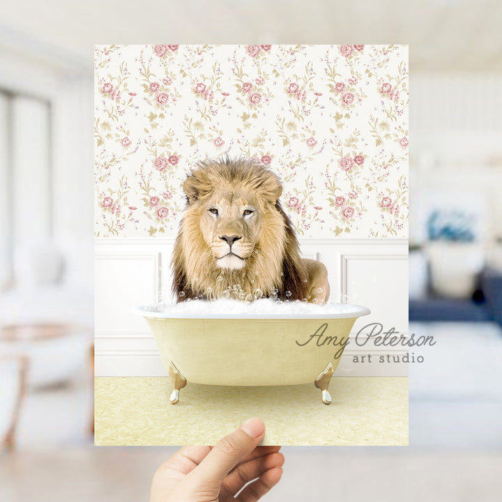 a hand holding a card with a lion in a bathtub