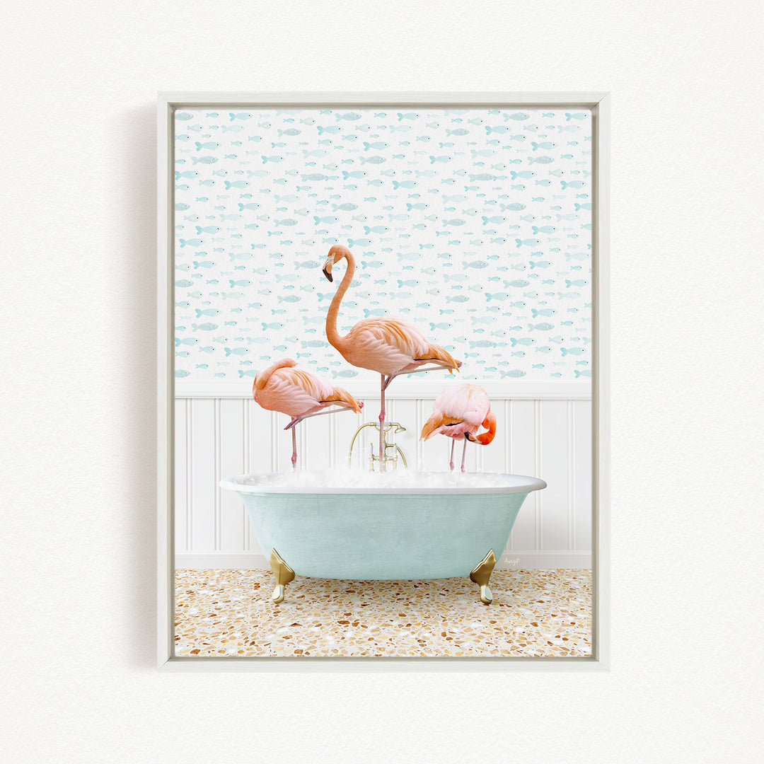 A framed image depicting three pink flamingos standing in a bathtub filled with water, with a patterned wall behind them.