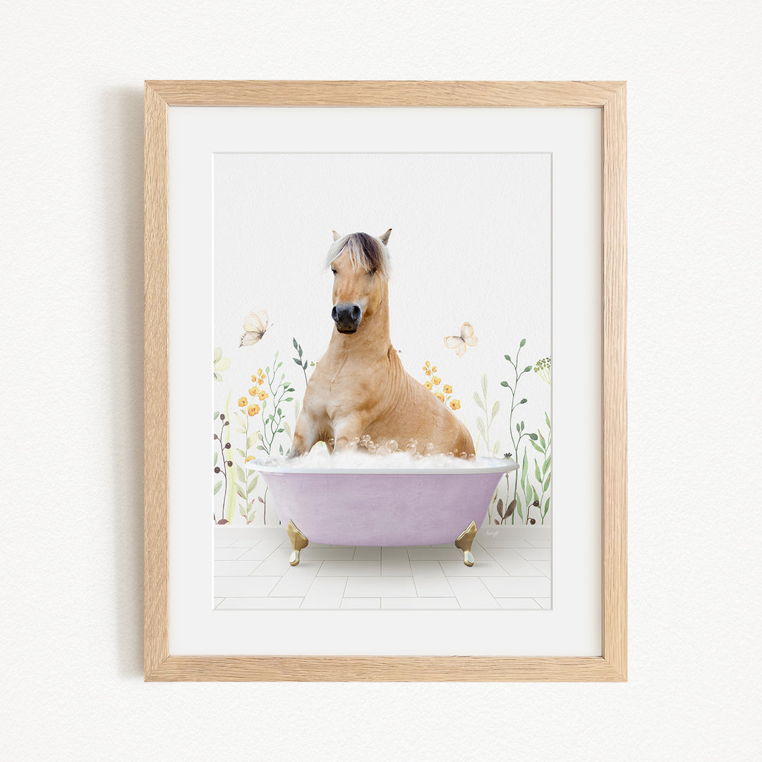 A light brown horse is sitting in a purple bathtub filled with bubbles, surrounded by flowers and butterflies.