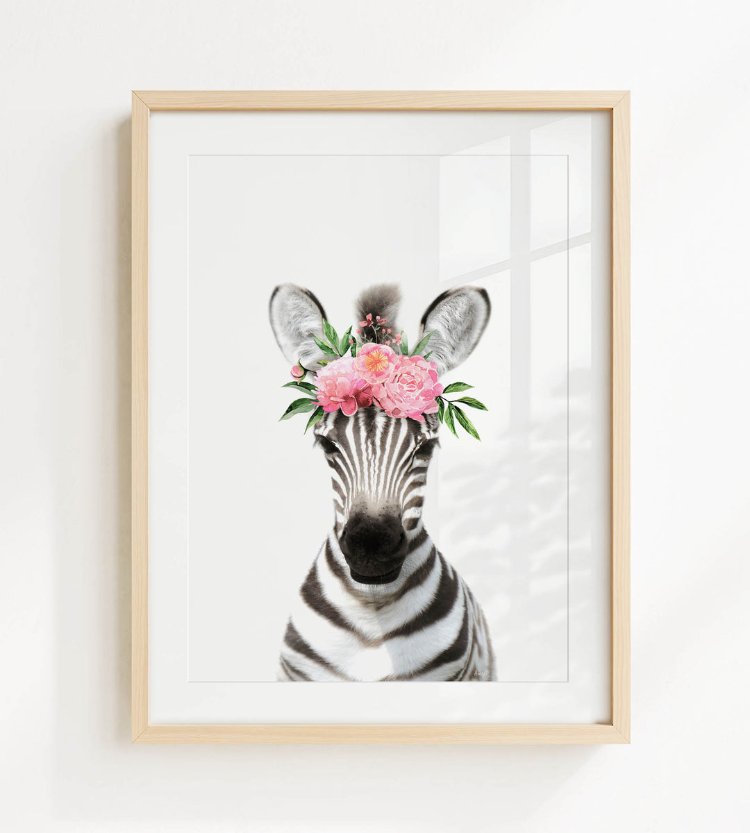 A framed print of a zebra wearing a floral headpiece.