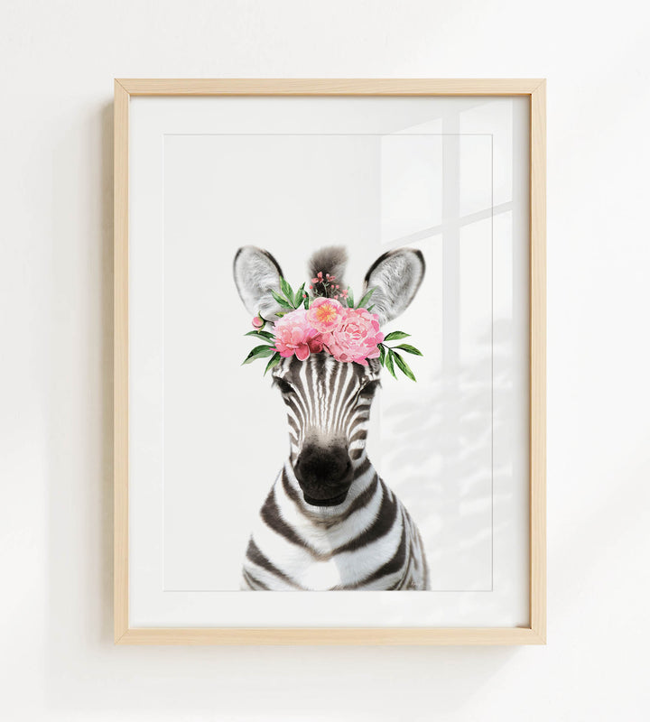 A framed print of a zebra wearing a floral headpiece.