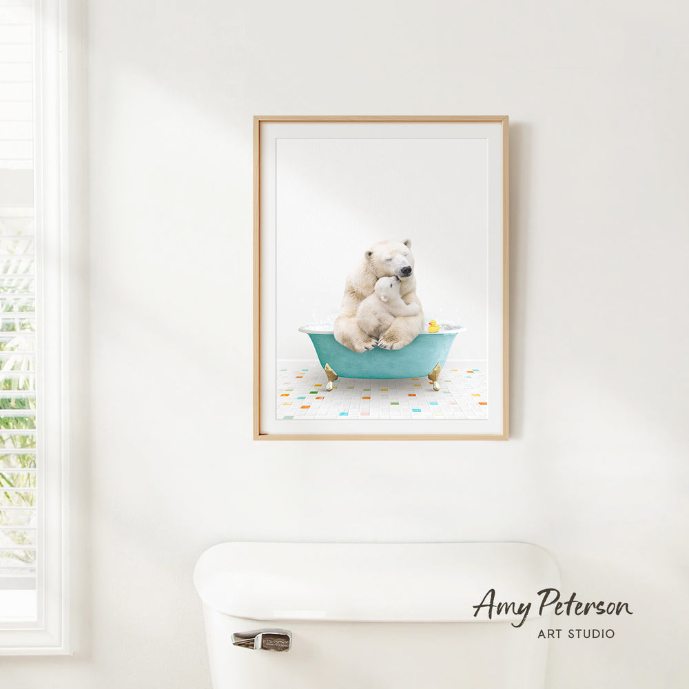 A framed image of a polar bear sitting in a bathtub, surrounded by colorful polka dots, is hanging on a white wall.