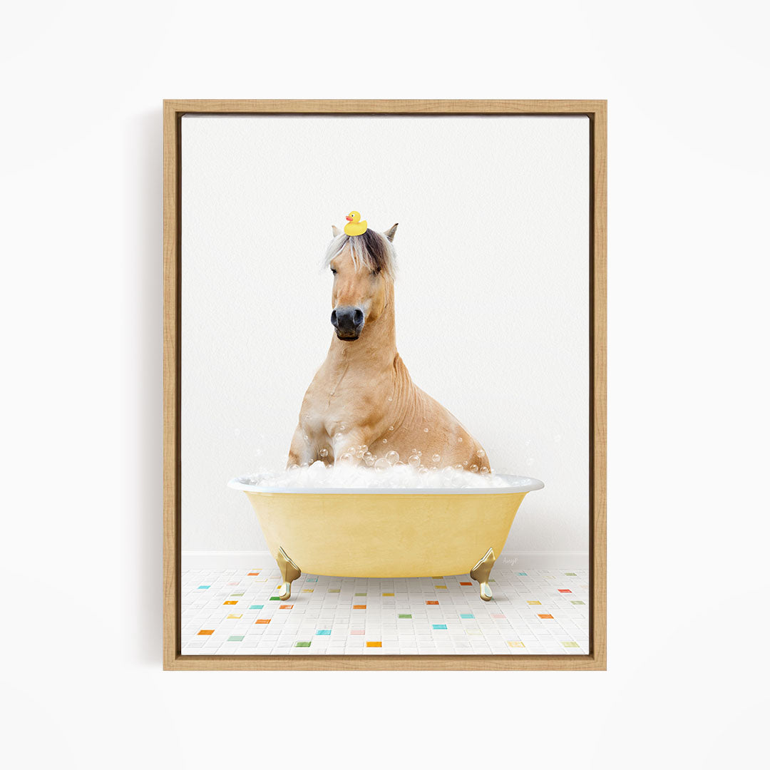 A brown horse is sitting in a yellow bathtub filled with bubbles, with a rubber duck perched on its head.