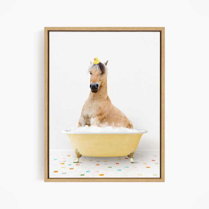 A brown horse is sitting in a yellow bathtub filled with bubbles, with a rubber duck perched on its head.