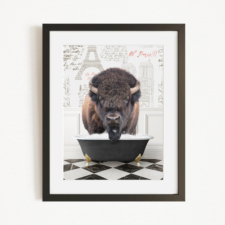 A buffalo is sitting in a bathtub, surrounded by a checkered floor and a backdrop featuring the Eiffel Tower and other Parisian landmarks.